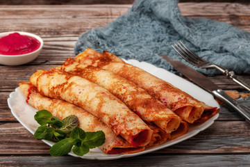 Pancakes with beetroot and cheese pasta and salmon