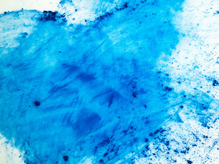 Scattered blue pigment. Abstract background.