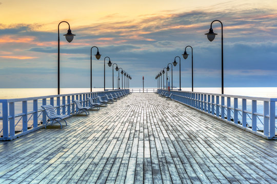 Beautiful landscape with wooden pier in Gdynia Orlowo at sunrise, Poland © Patryk Kosmider