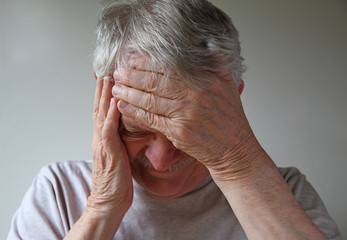Senior man with intense head pain