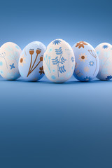 Five easter Eggs in blue and  rose color with a floral pattern arranged in a row on a blue background. Copy space for easter message available.
