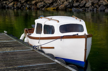 Small cute fisherman's boat. Traditional type of retro boats. Tobermory, Scotland