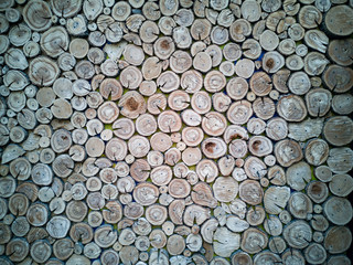 Lots of aged cracked wooden circular tree section with rings and texture placed on stone table with copy space