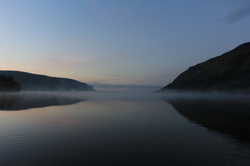 Fototapeta na wymiar early morning over a mountain lake