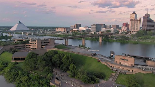 Aerial flying over downtown Memphis and Mud Island River Park at sunset. Memphis, Tennessee, USA