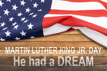 Fototapeta na wymiar Martin Luther King Jr. Day - USA flag on wooden background