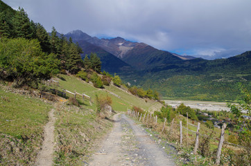 Scenic slope and empty country road. Nature and travel. Georgia, Samegrelo-Zemo Svaneti region, Mestia