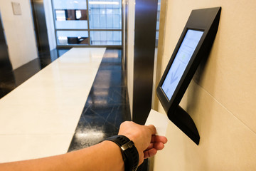 RFID reader in front of the elevator which only allow authorized person in the building to use. One of security feature in modern condominium, apartment or  office building