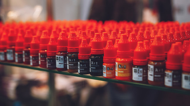 Bottle Color Correct Ink Set for Cosmetic Tattooing. Many microblading Permanent Makeup Pigments in bottles in shop, beauty salon. Kiev, Ukraine - April, 11, 2019