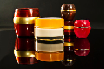 Multicolored bottles of cream.