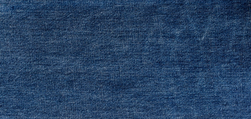 Fototapeta na wymiar texture of blue jeans denim fabric
