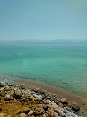 Fototapeta na wymiar Dead sea, salt in the sea, stones in salt