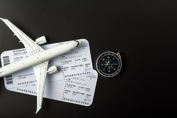Top view of Jet airliner with boarding pass and compass. Online flight purchase, flight tickets...
