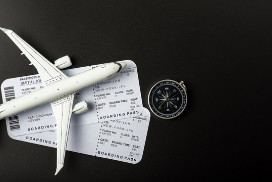 Top view of Jet airliner with boarding pass and compass. Online flight purchase, flight tickets booking, Copy space