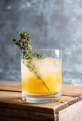 Old fahioned lemon beverage on the rustic background. Selective focus. Shallow depth of field.