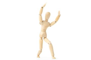 Wooden figure dancing on white background