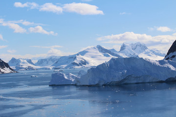 Fototapeta na wymiar Mountains of the Antarctic Peninsula. Icebergs and mountains in the Gerlache Strait in the Danco Coast, Antarctica