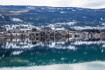 View of town reflected in a lake. Lake Country, Okanagan, British Columbia