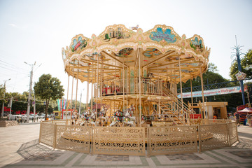 carousel with horses in the Park in summer
