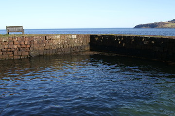 Wall on the coast near Brodick, Isle of Arran, Sotland, United Kingdom