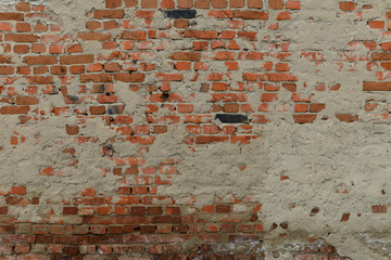 Full old cracked brick wall surface with cracks in full screen