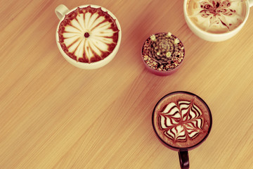 Coffee cups on table. Top view with cups of coffee and copyspace . 