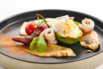 Grilled squid with avocado and egg