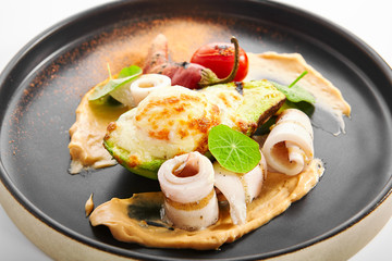 Grilled squid with avocado and egg