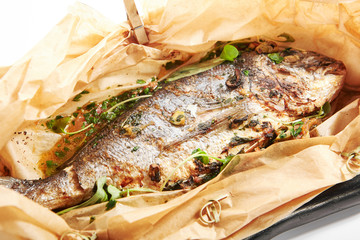 Baked dorado fish in parchment