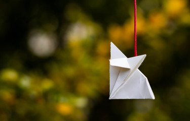 paper origami on blue sky background