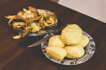 Peeling potatoes with a knife at home