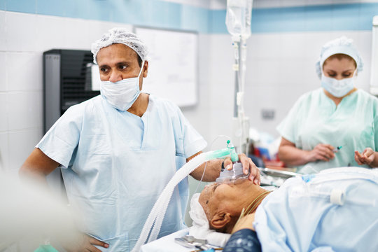 Doctor giving anesthesia to patient