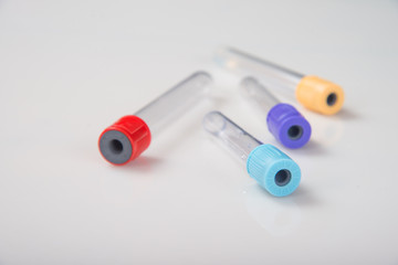 Blood tubes on a light background. The concept of blood testing.