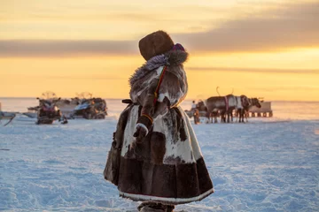 Fotobehang  Far North, Yamal Peninsula, Reindeer Herder's Day, local residents in national clothes of Nenets © evgenii