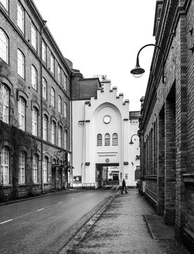 A Man Walking In The Street Of Tampere In Black And White. 