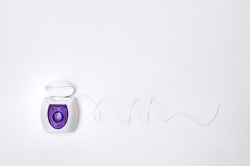 dental floss, container on a white background, long floss, isolate