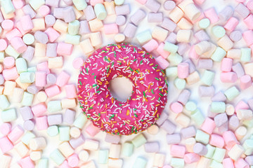 donut in a round marshmallow frame on a white background. top view photo