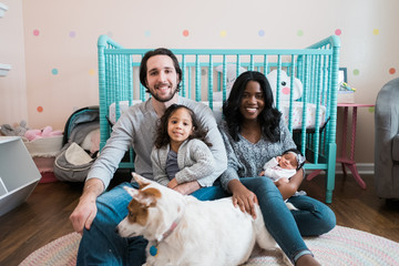 Happy Family portrait with newborn and smiling big sister