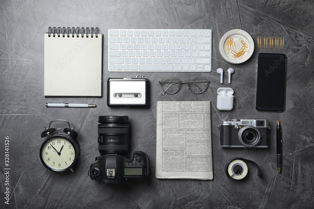 Sticker Flat lay composition with equipment for journalist on grey table