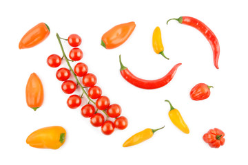 Cherry tomatoes, cayenne and chili pepper isolated on a white background. View from above.