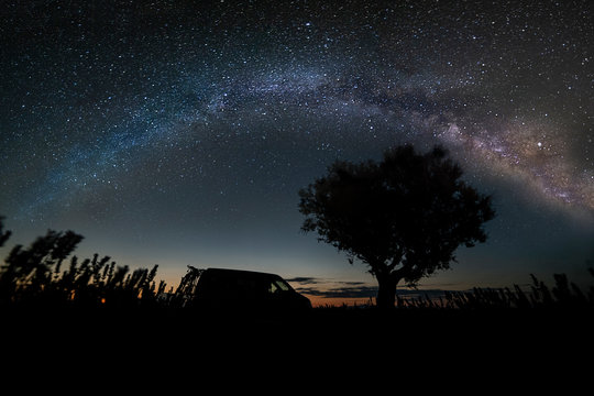 Camping van under the milky way