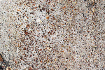 dirty grey concrete material with small stones for the background