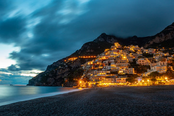 Landscape with Positano town at famous amalfi coast at night, Italy - obrazy, fototapety, plakaty