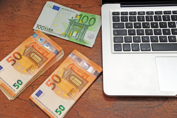Fototapeta na wymiar euro money and computer keyboard - economic transaction and bank on line shopping