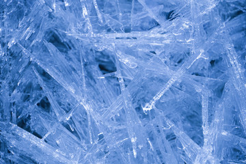 Crystalline bluish icy water on a stream