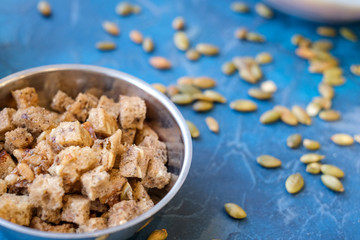 Cubes of bread croutons, fried crackers in small squares of whole- grain bread