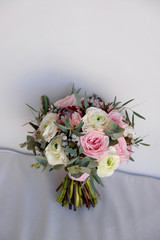 Wedding flowers, bridal bouquet closeup. Decoration made of roses, peonies and decorative plants, close-up, selective focus, nobody, objects