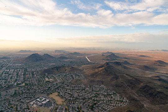 An aerial view of houses among mountains in the desert