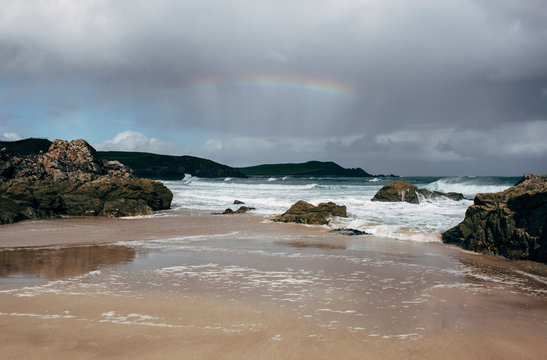 Rainbow over Sango Sands Bay. Durness, Highlands, Scotland, UK.
