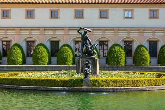 Hercules statue in the middle of a pond in the Waldstein garden in Prague, Czech Republic